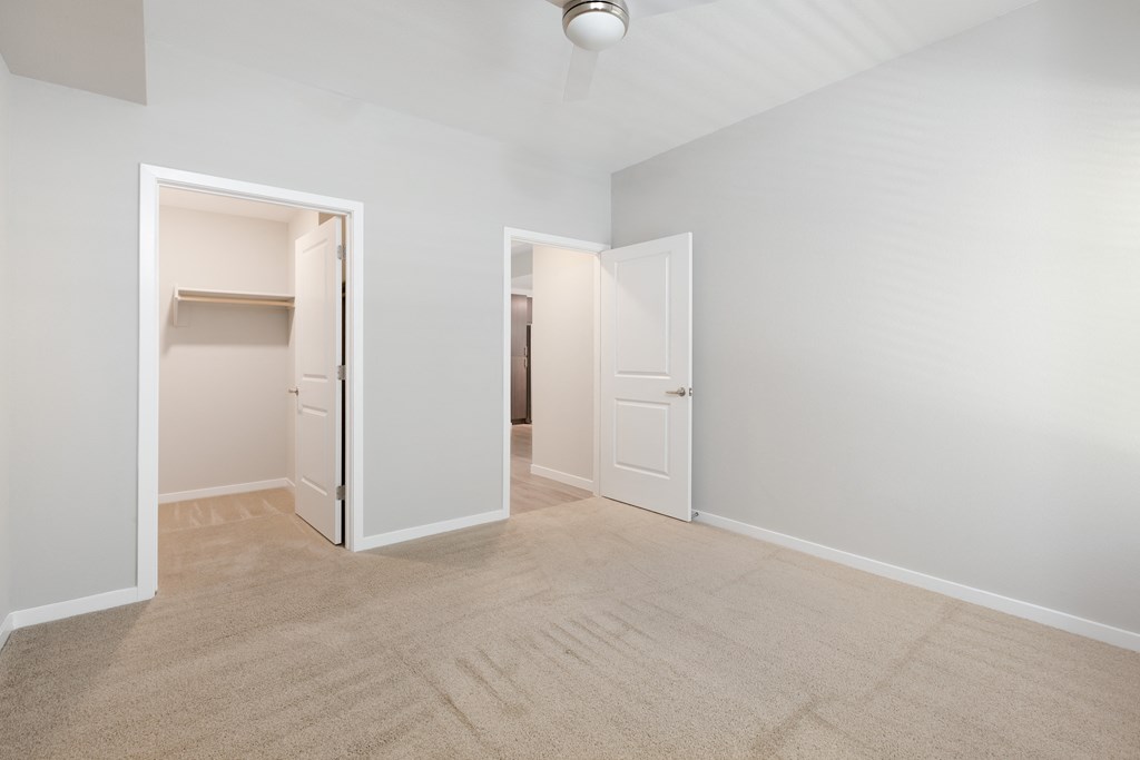 Spacious Carpeted Rooms With Walk-In Closets AtUnion at Roosevelt Apartments In Phoenix, AZ