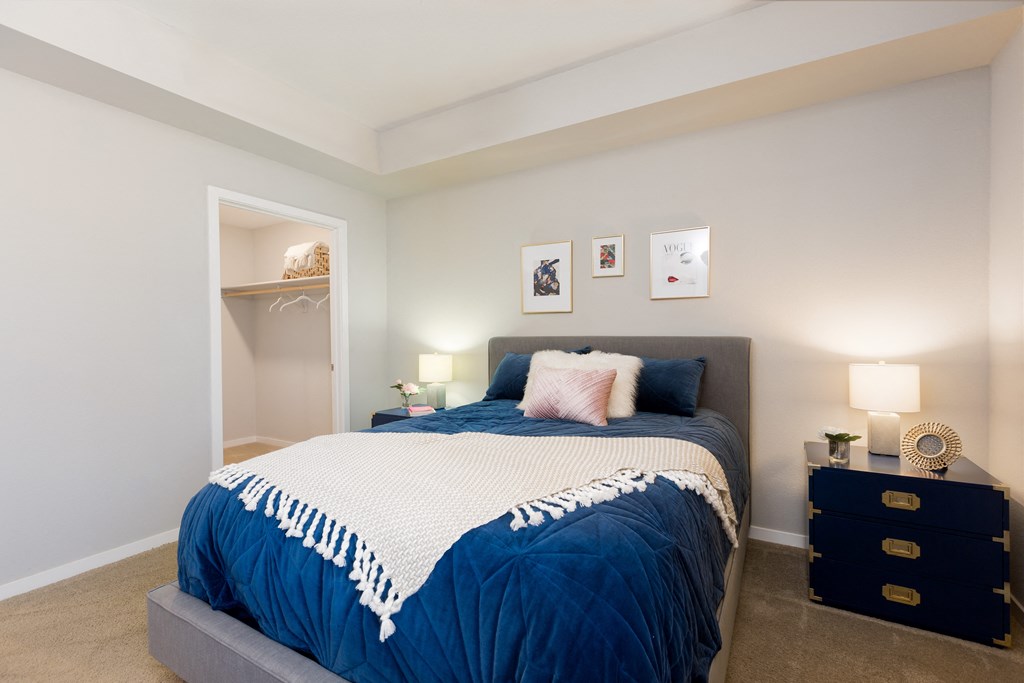 Carpeted Bedroom With Walk-In Closet At Union at Roosevelt Apartments In Phoenix, AZ