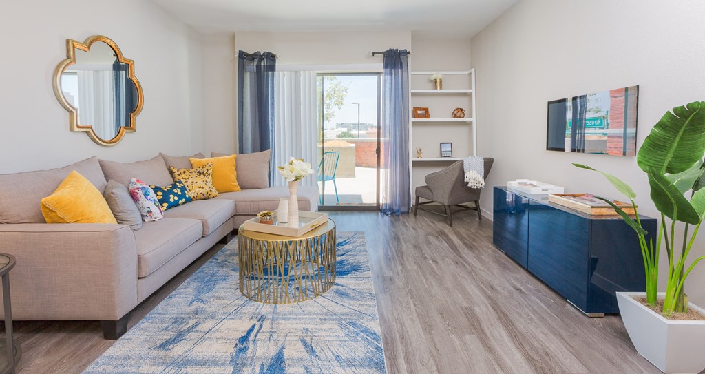 Apartment Living Room And Door To Patio At Union at Roosevelt Apartments In Phoenix, AZ