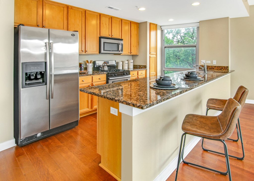 a kitchen with a counter top and a refrigerator