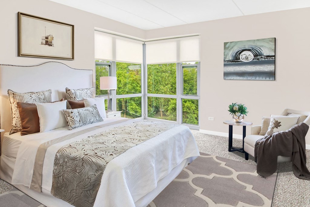 a bedroom with a bed and a large window