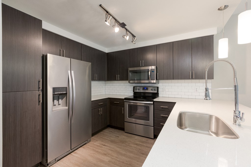 Stainless Steel Appliances And Modern Cabinetry At Union at Roosevelt Apartments In Phoenix, AZ