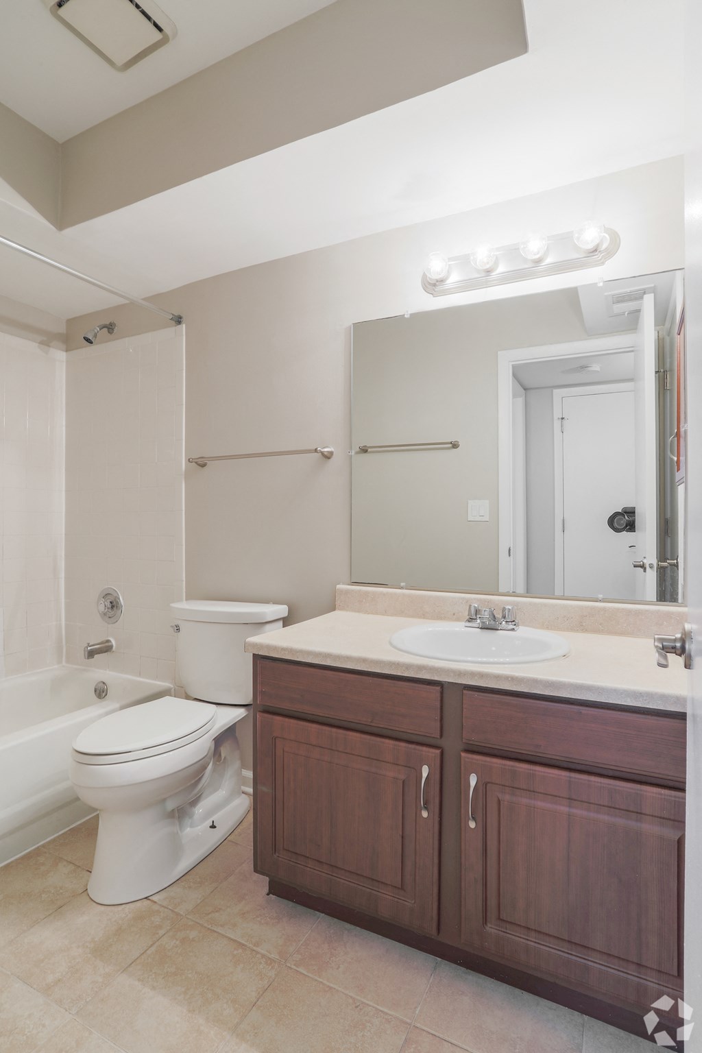 a bathroom with a toilet sink and a mirror