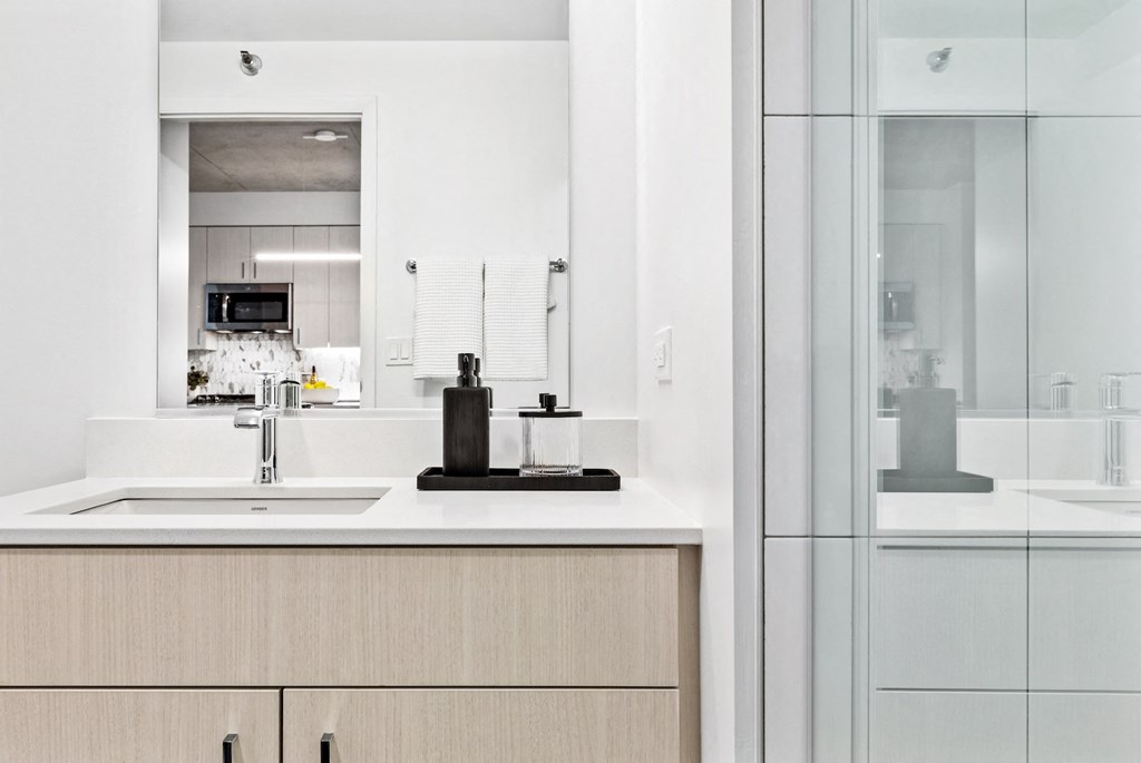 a kitchen with a sink and a glass door