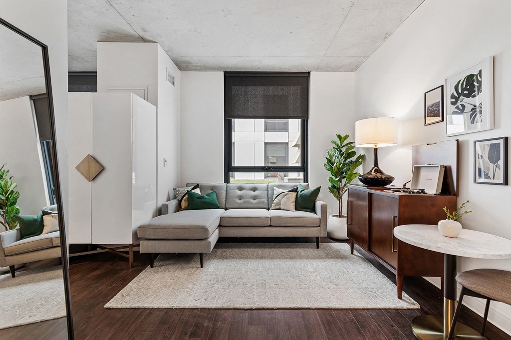 a living room with a couch and a table