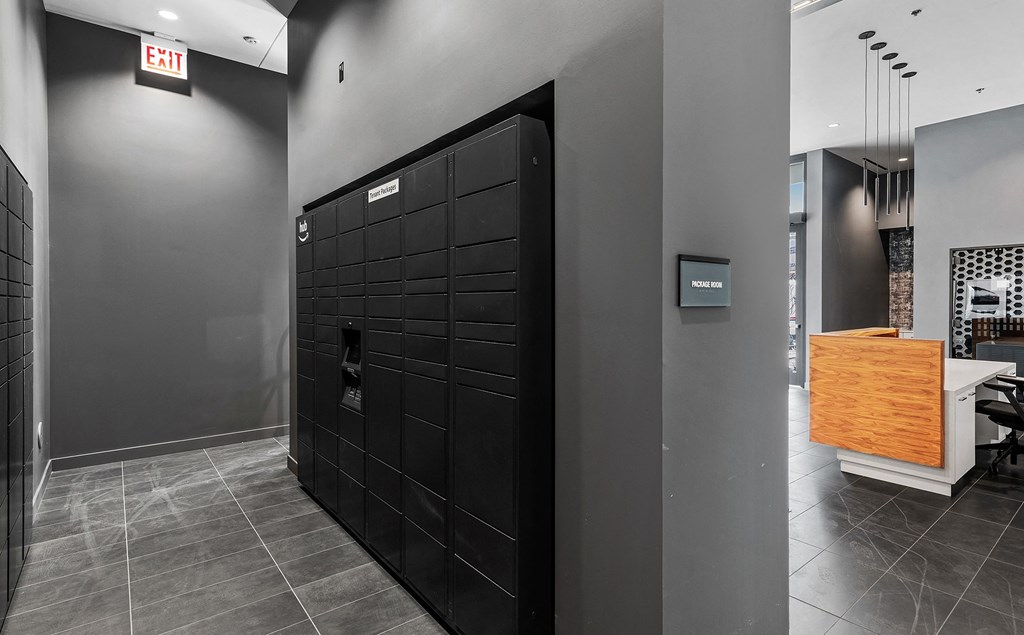 a black door in a room with a desk and a chair