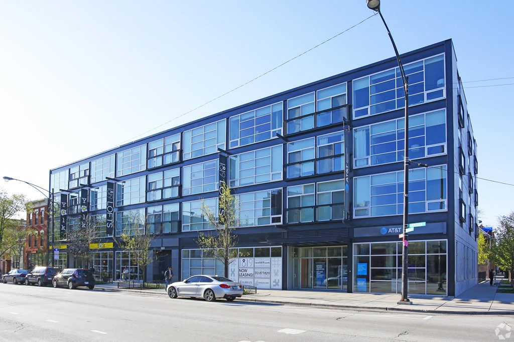 a large blue building on the corner of a city street