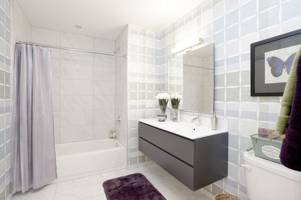 a bathroom with a sink and a bath tub