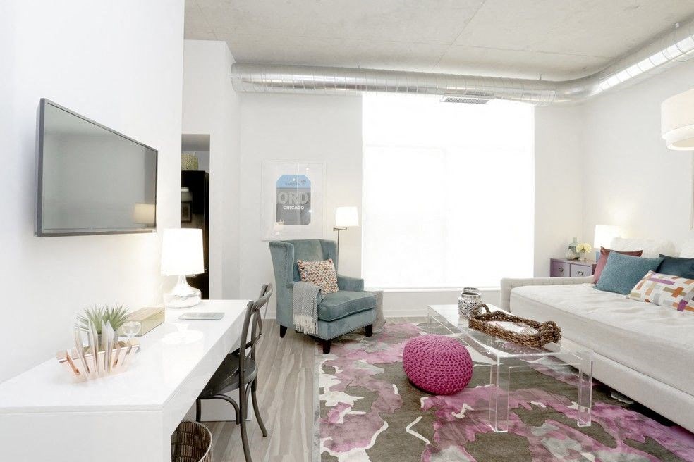 a living room with a couch and a tv