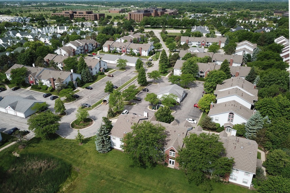an aerial view of a neighborhood with houses and trees