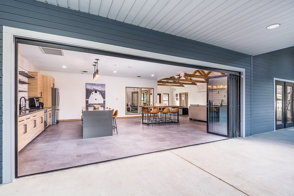 a large kitchen and dining room with a large sliding glass door