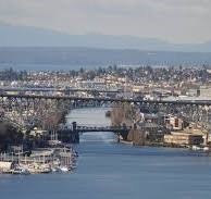 A river flows through a city with a bridge crossing it.