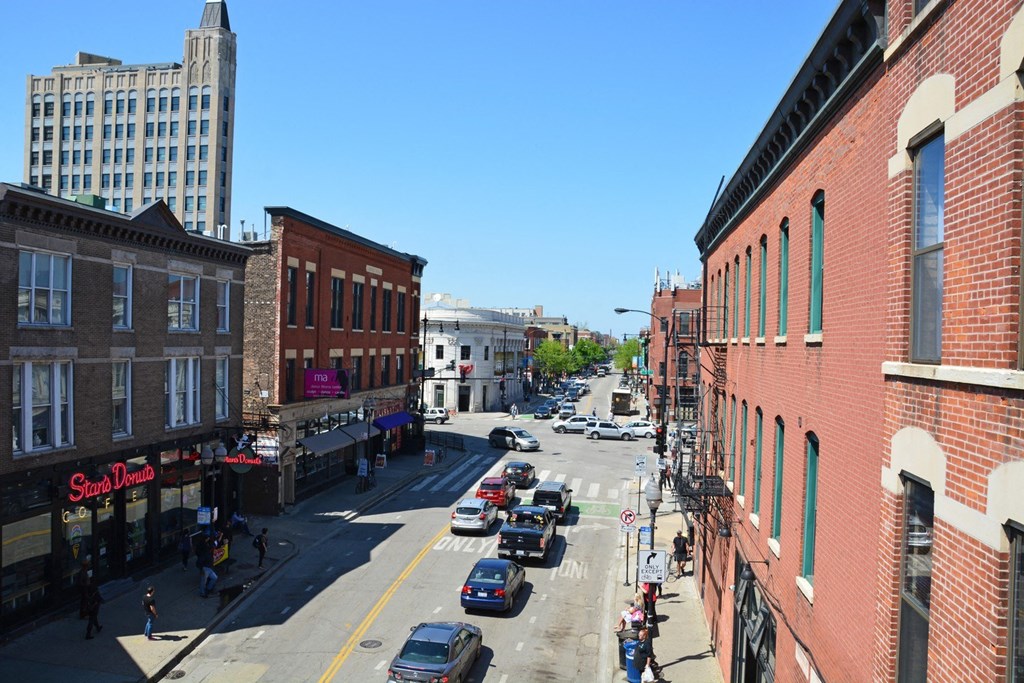 a view of a city street from a balcony