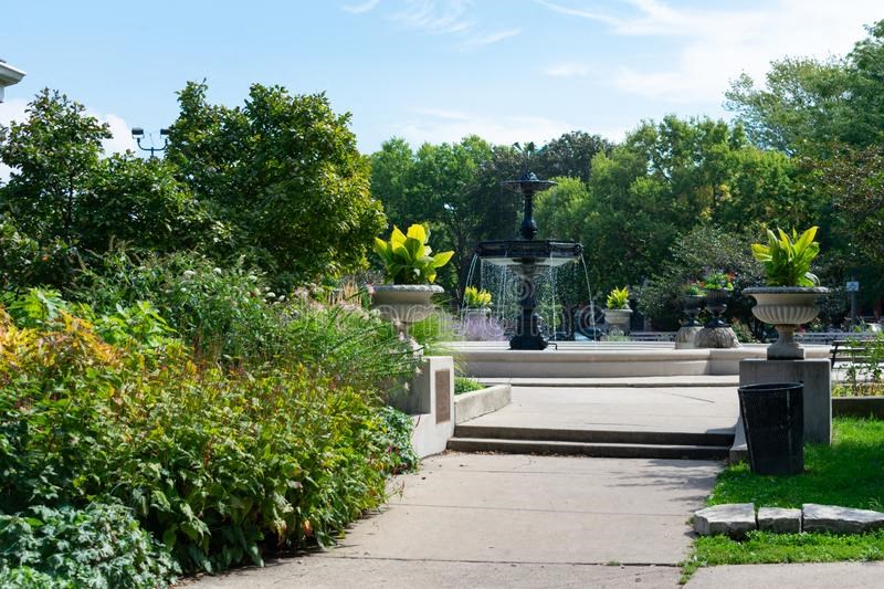 a fountain in the middle of a park