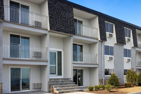 Exterior view of building with bushes and a sidewalk at 151 Ocean Road LLC, Narragansett, RI, Rhode