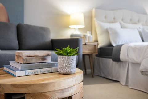 Stylish bedroom lighting with comfortable seating at 151 Ocean Road LLC, Narragansett, Rhode