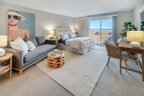 Cozy Bedroom with wide windows and carpeting at 151 Ocean Road LLC, Narragansett, RI, 02882
