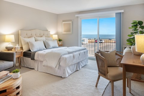 Cozy Bedroom with a bed and a view of the ocean at 151 Ocean Road LLC, Narragansett, 02882