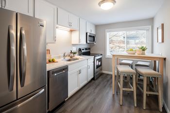 Modern kitchen with stainless steel appliances and granite counter tops at 151 Ocean Road LLC, Narragansett