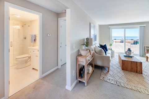 Carpeted living room with wide windows at 151 Ocean Road LLC, Narragansett, RI, Rhode , 02882