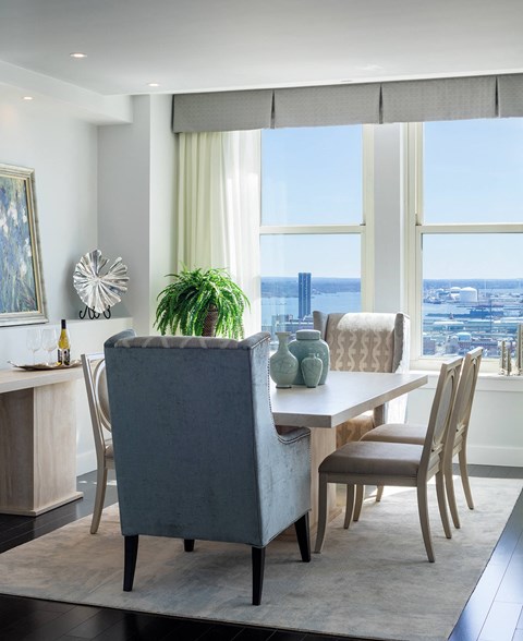 A dining room with a table and chairs at Residences Providence, Providence, RI