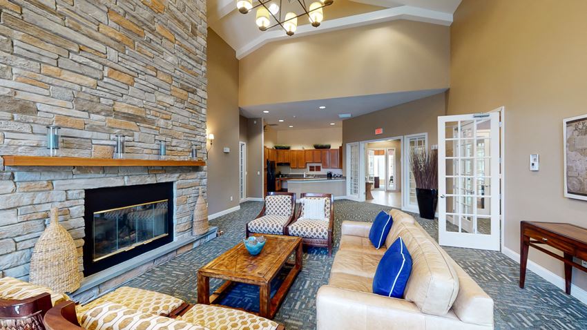 Boston road clubhouse lounge with fireplace and kitchen