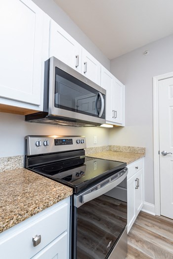 Drum Hill 2 Bedroom Apartment Kitchen with stainless steel range and microwave, granite counters - Photo Gallery 25