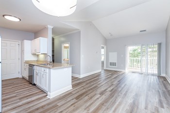 Drum Hill 2 Bedroom Apartment living room family room, with kitchen and balcony. - Photo Gallery 33