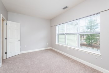 Drum Hill 2 Bedroom Apartment bedroom two with plush carpeting and extra large window - Photo Gallery 8