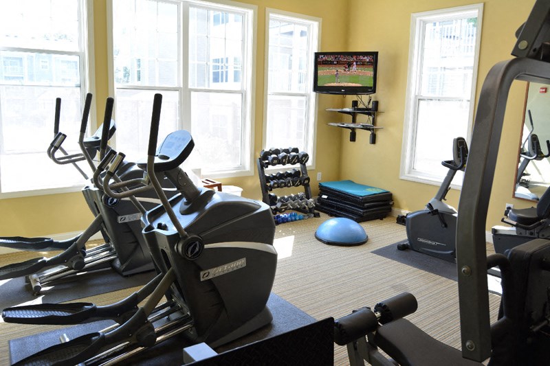 Commons at boston road billerica fitness center with cardio equipment and weights