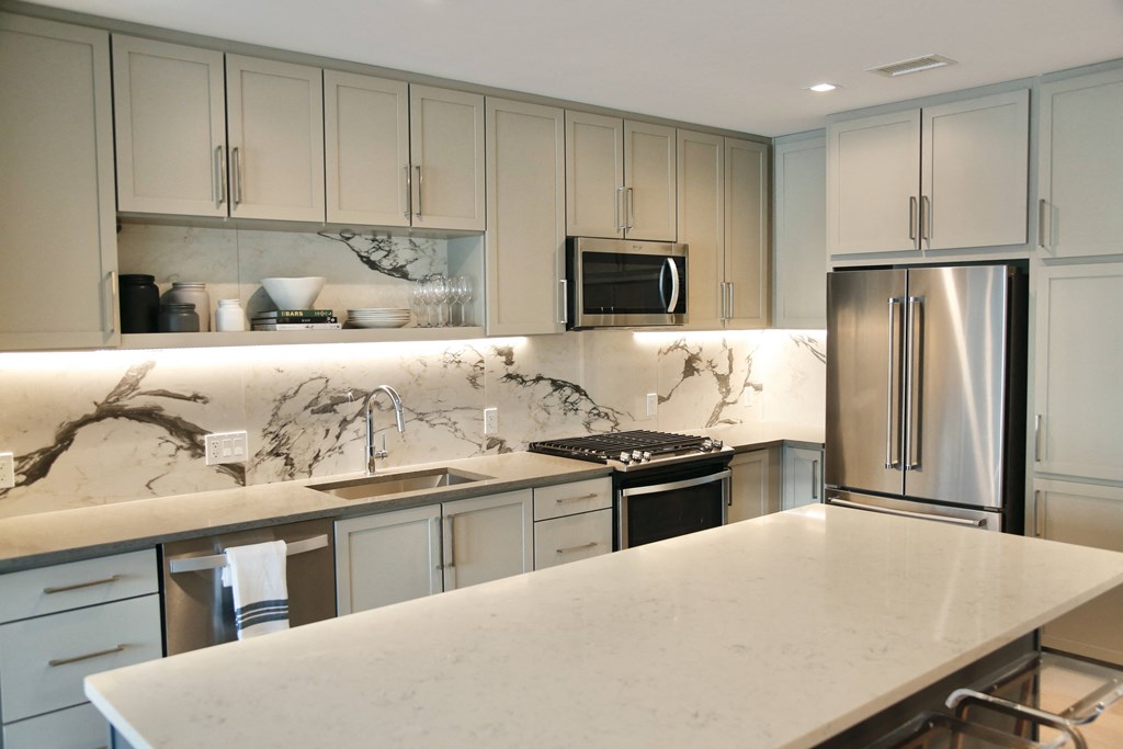Kitchen with island and stainless steel appliances