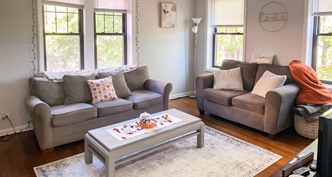 a living room with couches and a coffee table
