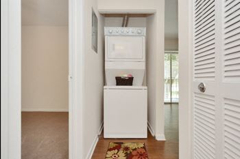 a laundry room with a washer and dryer