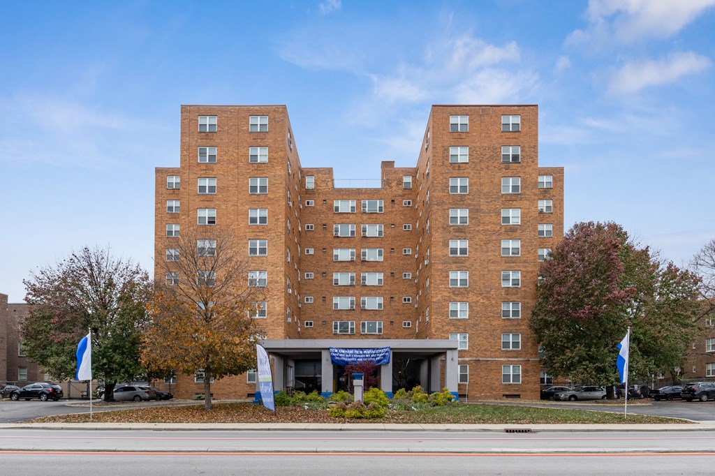 a large brick building on the side of a street