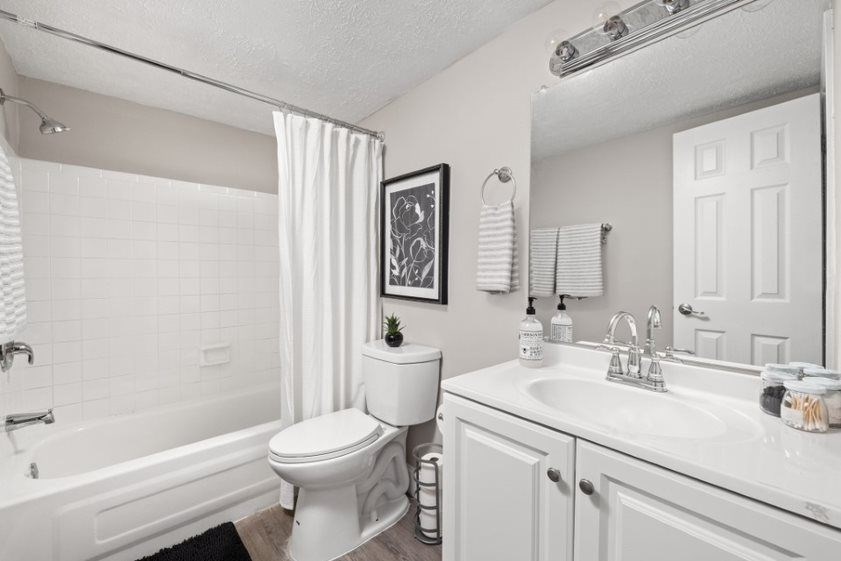 a bathroom with a toilet sink and bathtub