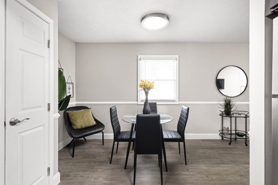 a dining room with a table and chairs