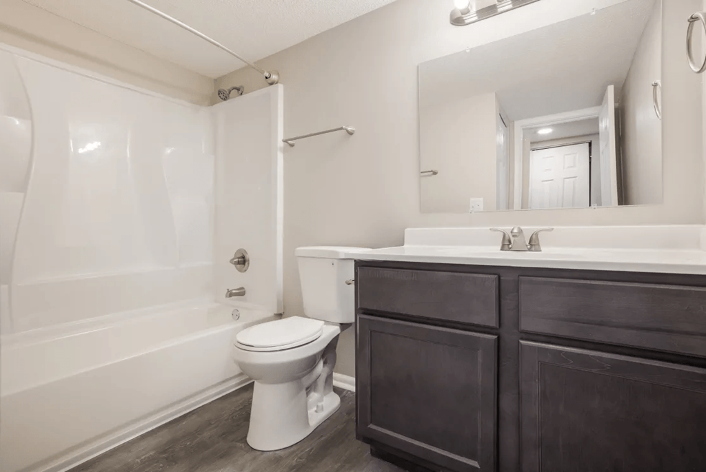 a bathroom with a toilet sink and bathtub