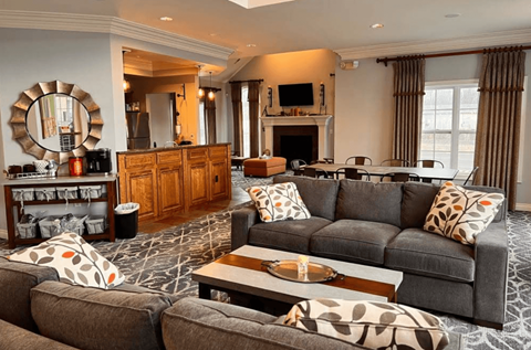 A living room with a grey couch and a coffee table.