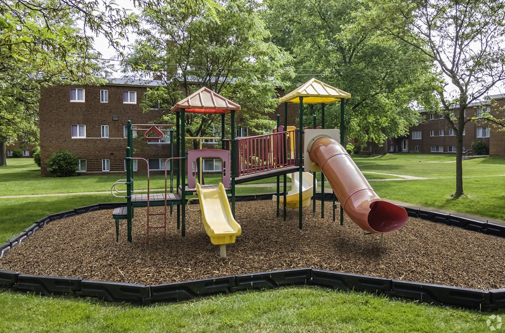 a playground with slides and monkey bars