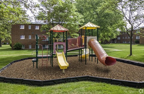 a playground with slides and monkey bars