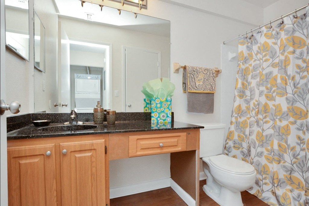 A bathroom with a sink toilet and shower at Aqua Bay Apartments in Naples, FL 34116