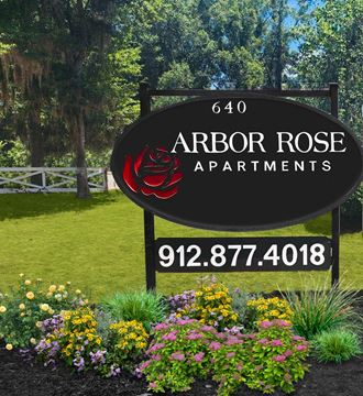 a sign that reads arbor roses apartments