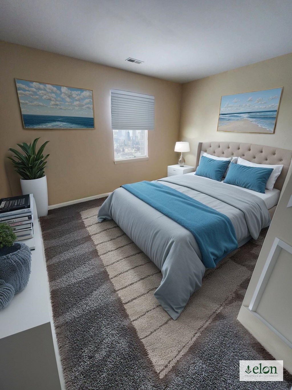 A bedroom with a large bed and a painting on the wall.