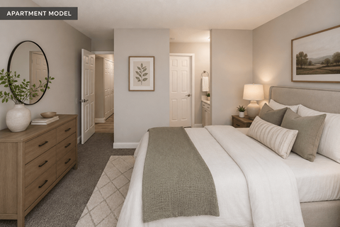 A well-lit bedroom with a large bed and a wooden dresser.