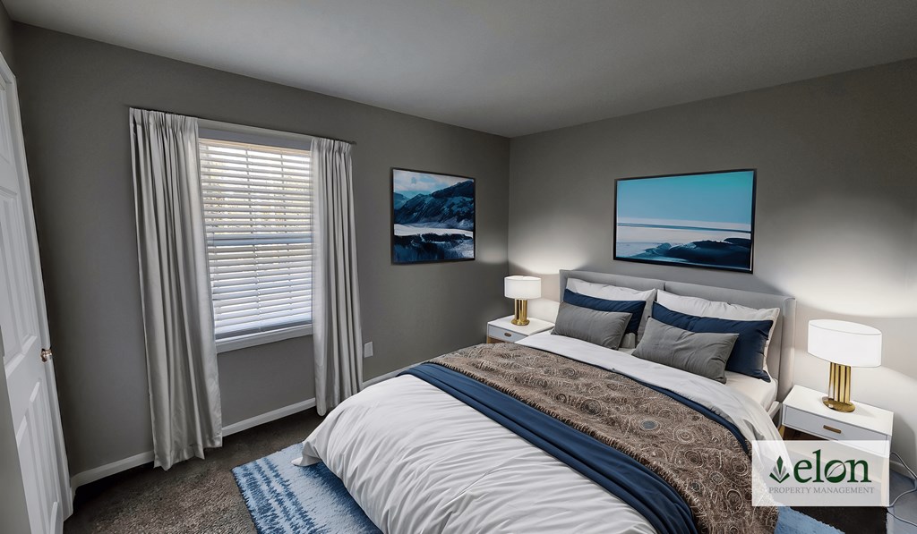 A bedroom with a bed, two lamps, and two pictures on the wall.