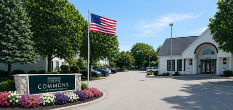 The entrance to a building with the sign "Commons" in front of it.