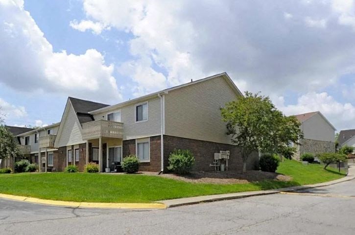 Exterior of Fox Club apartment buildings with large grassy yards.