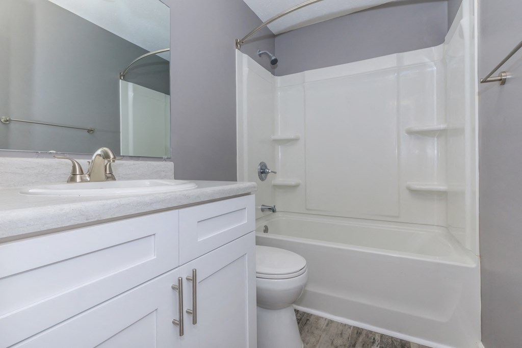 a bathroom with a sink toilet and a shower