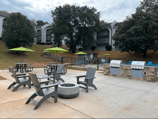 A patio with chairs and tables is set up.