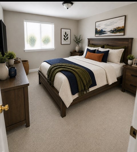 A bedroom with a bed, nightstand, and a painting on the wall.